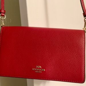 Coach clutch crossover purse. Brick Red. Used one time. Brand new condition.